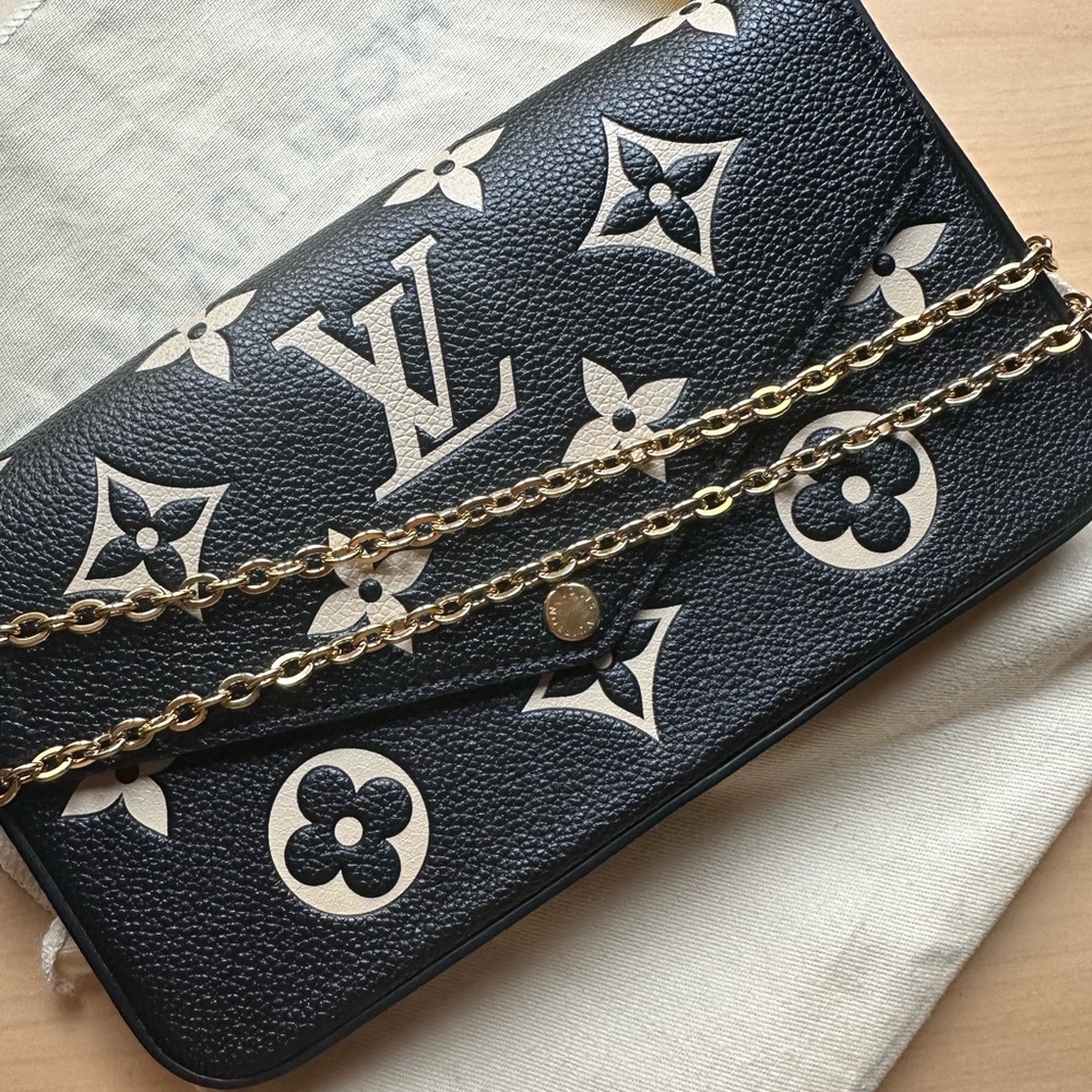 Louis Vuitton
Bicolor Monogram Empreinte Felicie Pochette Bag